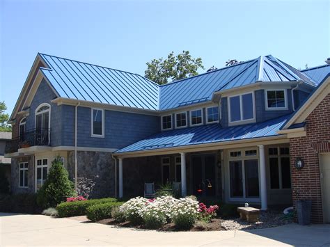 blue house with gray metal roof|blue metal roofing panels.